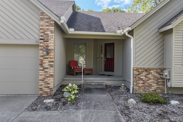 view of exterior entry featuring a garage