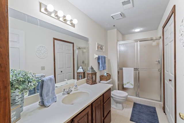 bathroom featuring toilet, vanity, and walk in shower