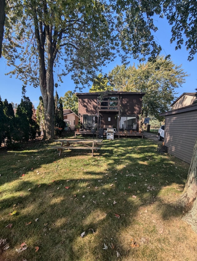 view of yard featuring a wooden deck