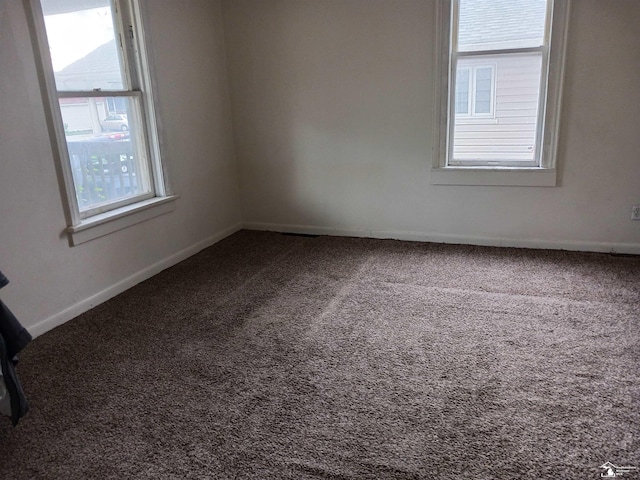 639 Michigan Ave, Monroe, MI 48162 - carpeted spare room featuring baseboards