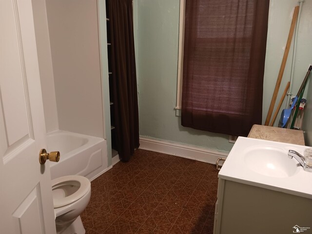 full bathroom featuring tile patterned flooring, vanity, shower / tub combo, and toilet