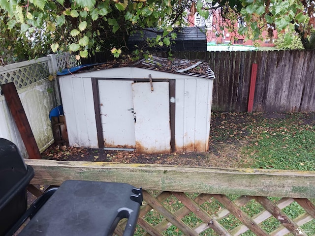 639 Michigan Ave, Monroe, MI 48162 - view of shed with a fenced backyard