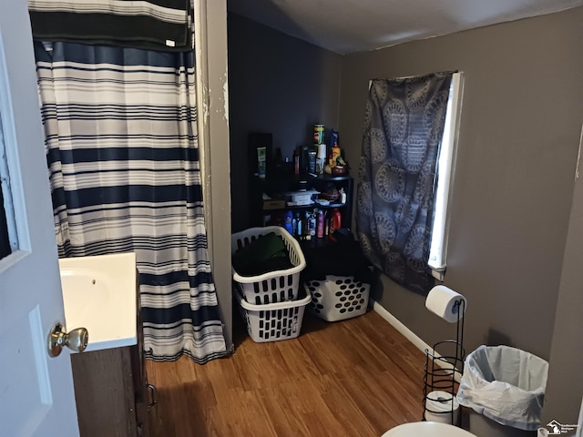 bathroom with wood-type flooring