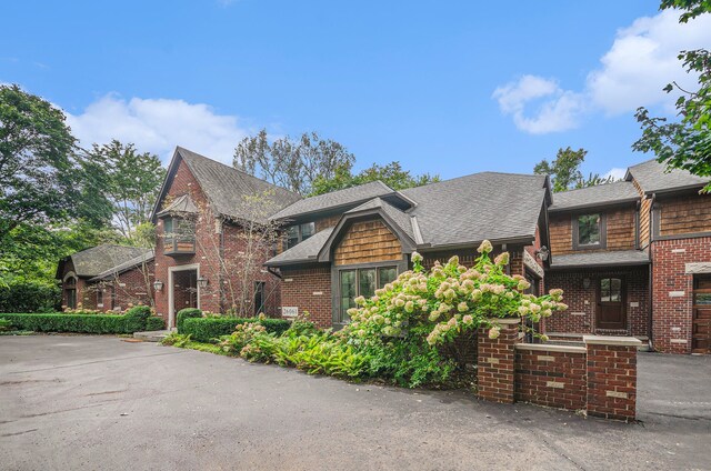 26061 Hawthorne Dr, Franklin, MI 48025 - shingle-style home featuring brick siding and roof with shingles