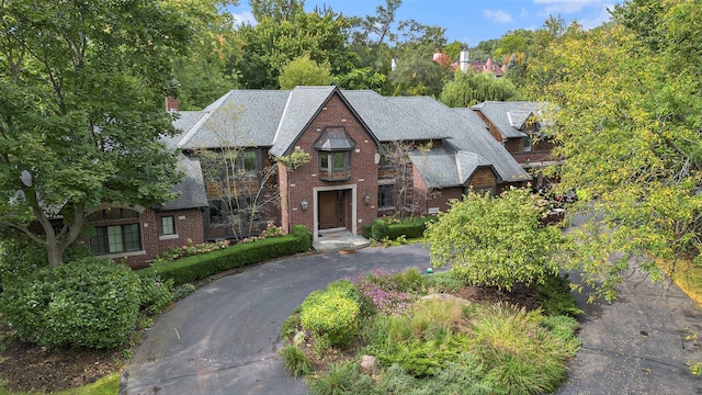 26061 Hawthorne Dr, Franklin, MI 48025 - tudor home featuring brick siding and driveway