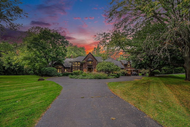 tudor home with a yard