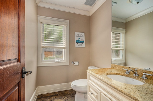 bathroom with wood-type flooring, vanity, toilet, and ornamental molding