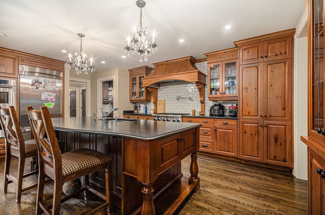 26061 Hawthorne Dr, Franklin, MI 48025 - kitchen featuring custom range hood, dark countertops, a chandelier, a sink, and decorative backsplash