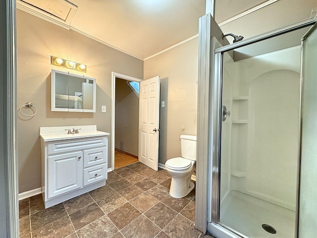 bathroom with vanity, toilet, and a shower with shower door