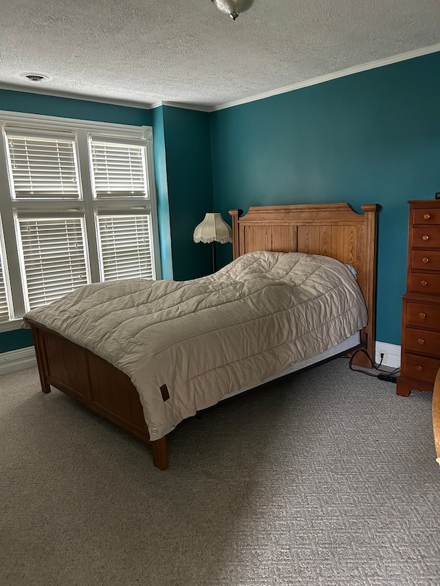 carpeted bedroom featuring a textured ceiling