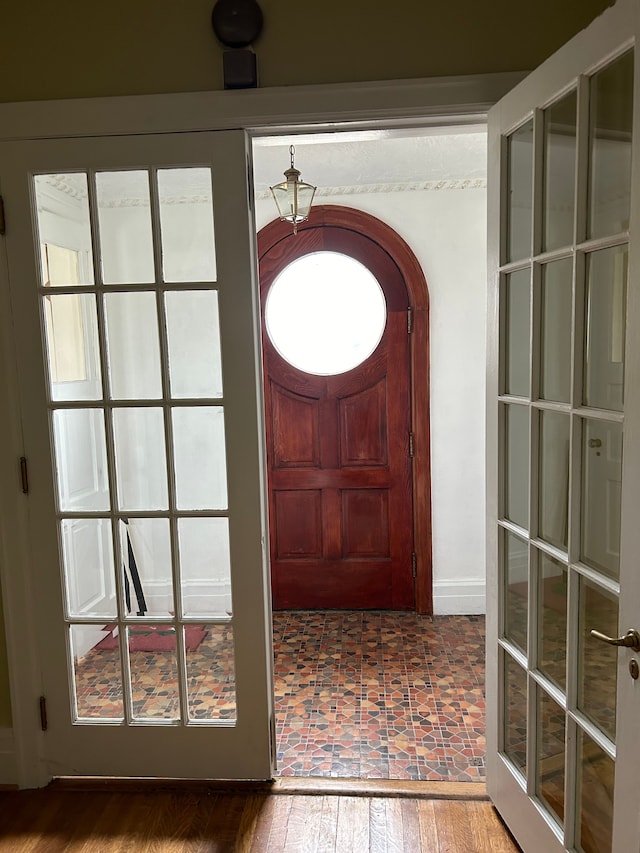 foyer with french doors and wood-type flooring