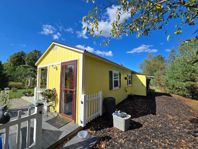 view of home's exterior featuring an outbuilding