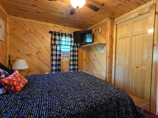 unfurnished bedroom featuring wood walls, a closet, ceiling fan, and wood ceiling