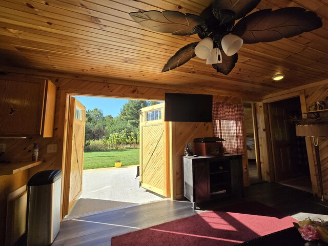 12259 Niemi, Kaleva, MI 49645 - interior space with wooden ceiling, wood walls, wood finished floors, and a ceiling fan
