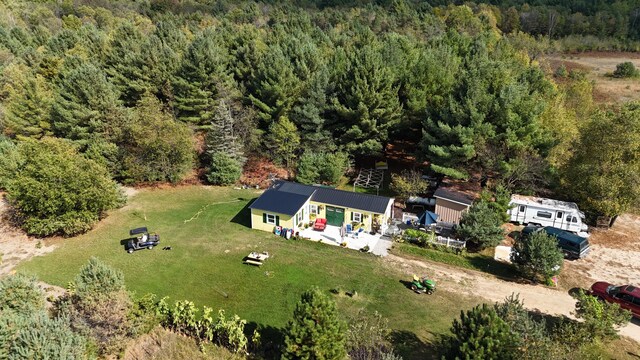 12259 Niemi, Kaleva, MI 49645 - view of subject property with a heavily wooded area