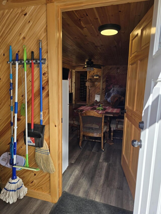 12259 Niemi, Kaleva, MI 49645 - hall featuring dark wood-type flooring, wood walls, and wood ceiling