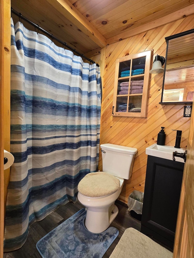 bathroom featuring wood ceiling, vanity, wooden walls, hardwood / wood-style flooring, and toilet