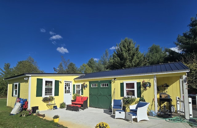 view of front of home with a patio area