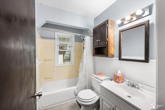 full bathroom featuring shower / bath combo, toilet, and vanity