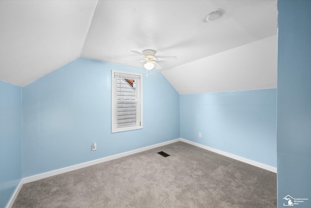 additional living space with ceiling fan, lofted ceiling, and carpet floors