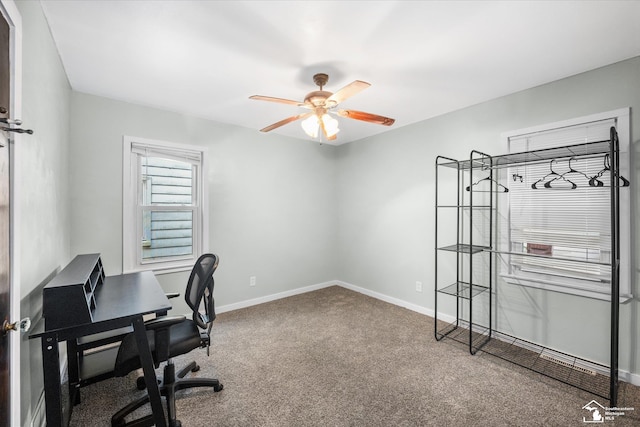 office space with carpet floors and ceiling fan