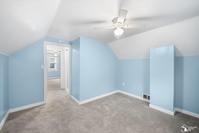 bonus room featuring light carpet, ceiling fan, and lofted ceiling