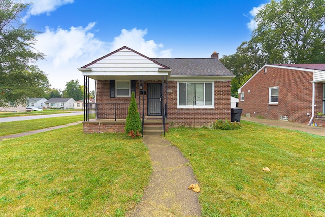 bungalow-style home featuring a porch and a front lawn