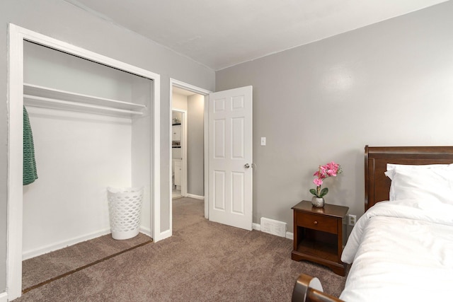 carpeted bedroom featuring a closet