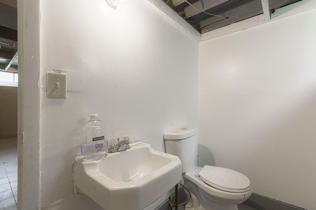 bathroom with toilet and sink