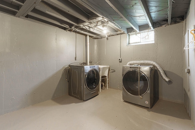 washroom featuring washing machine and dryer