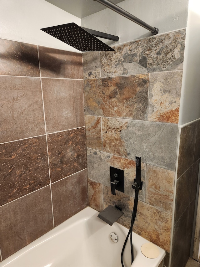 details with tiled shower / bath combo