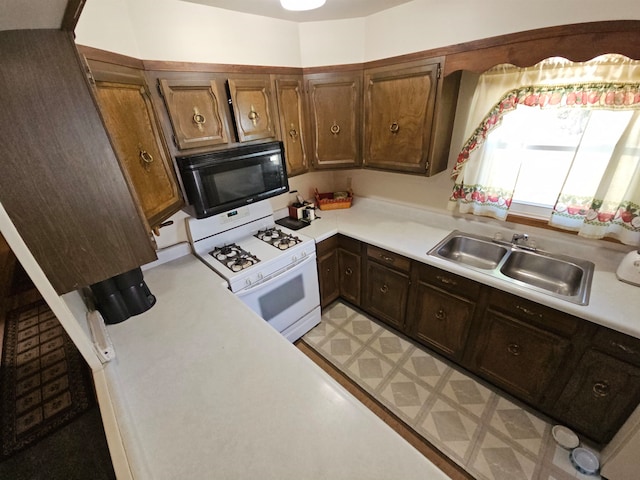 kitchen with gas range gas stove and sink