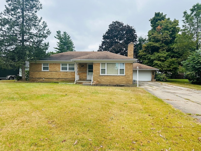 view of front of property with a garage and a front yard