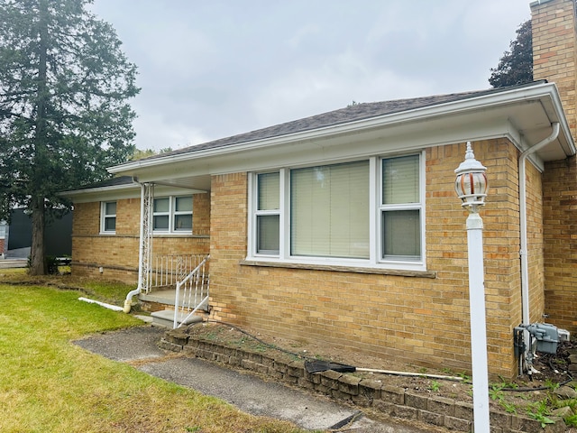 view of home's exterior featuring a yard