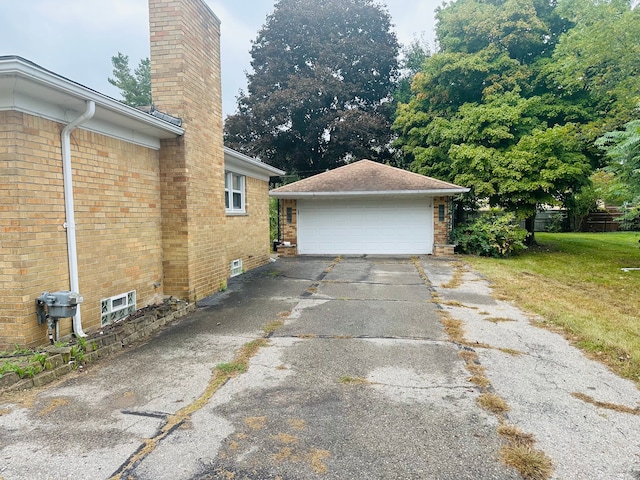 view of home's exterior with an outbuilding and a garage