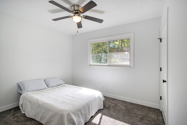 carpeted bedroom featuring ceiling fan