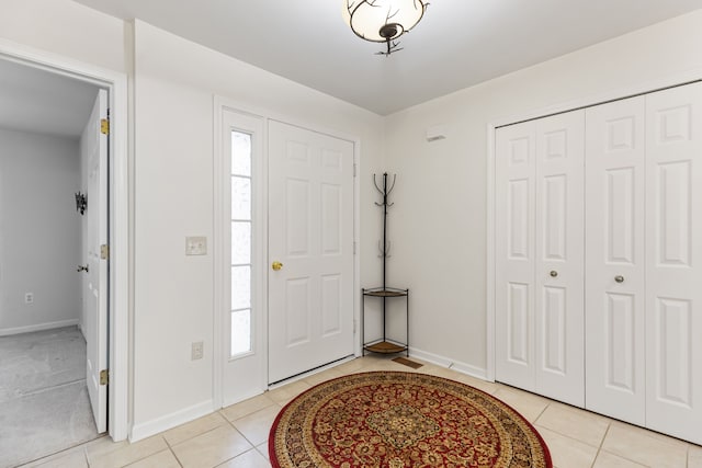 entrance foyer with light tile patterned floors