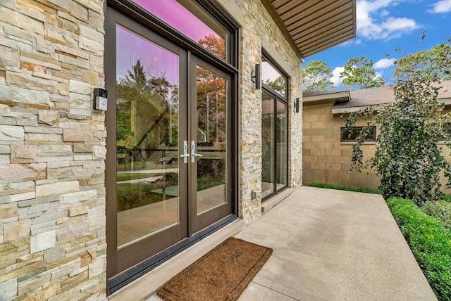 entrance to property with a patio