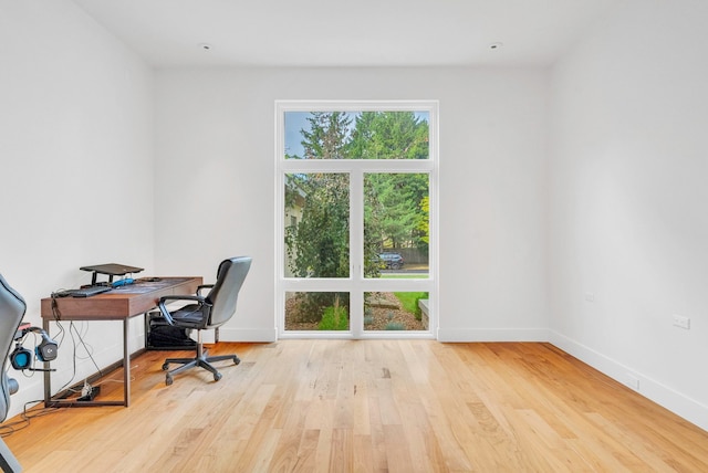 office space with light wood-type flooring