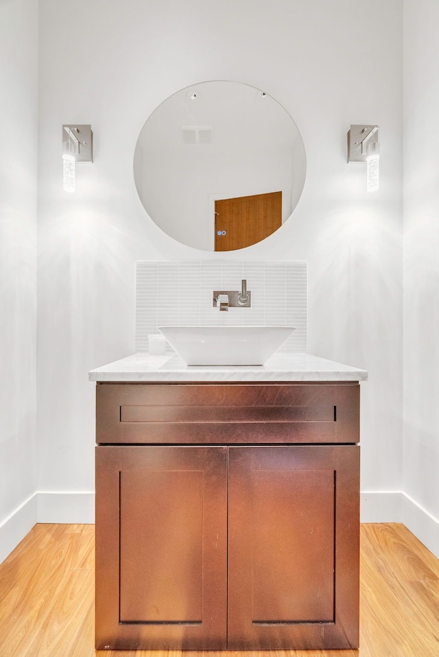 bathroom featuring hardwood / wood-style floors and vanity