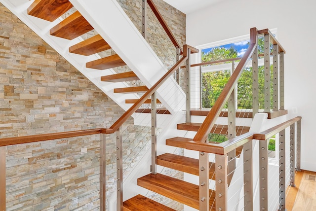 stairway featuring hardwood / wood-style flooring