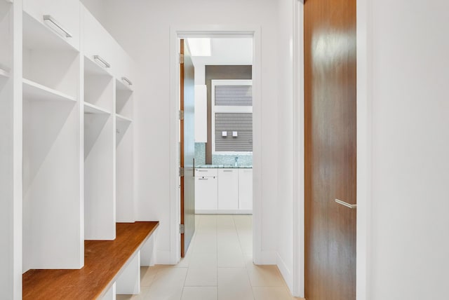 mudroom with light tile patterned floors