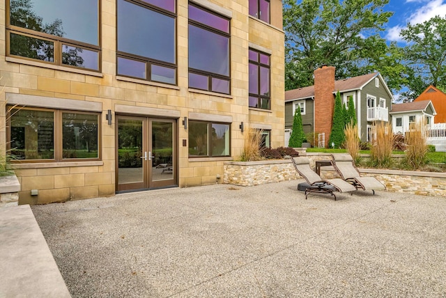 back of property featuring french doors and a patio