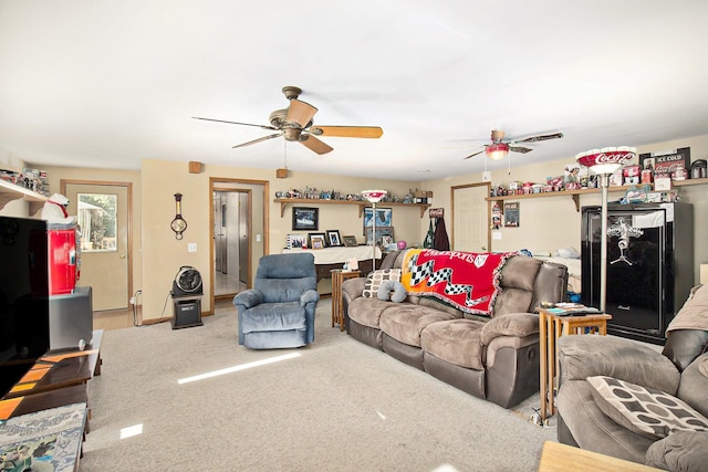 carpeted living room with ceiling fan