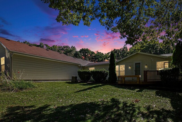 exterior space featuring a wooden deck and a yard