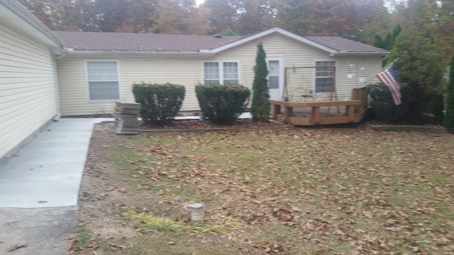 view of home's exterior featuring a deck