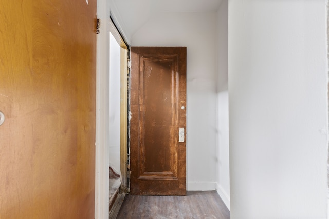 corridor with hardwood / wood-style flooring