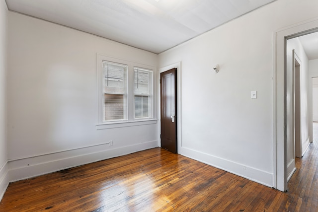 empty room featuring dark hardwood / wood-style floors