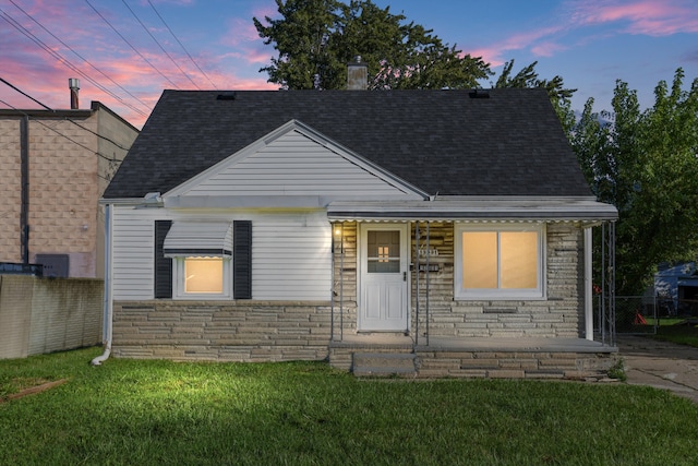 bungalow-style home featuring a yard