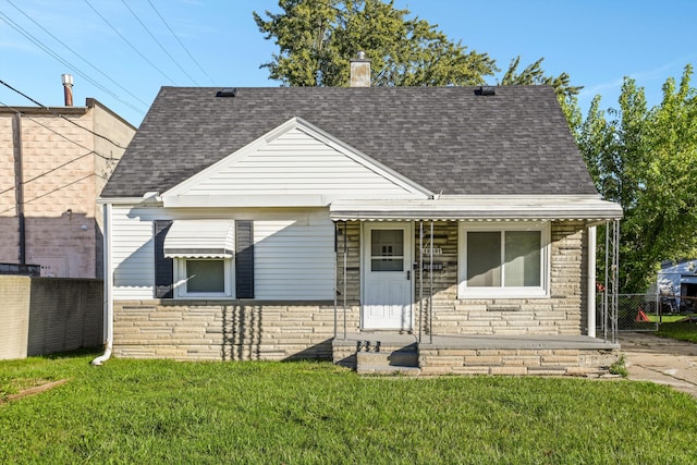 bungalow-style house with a front lawn